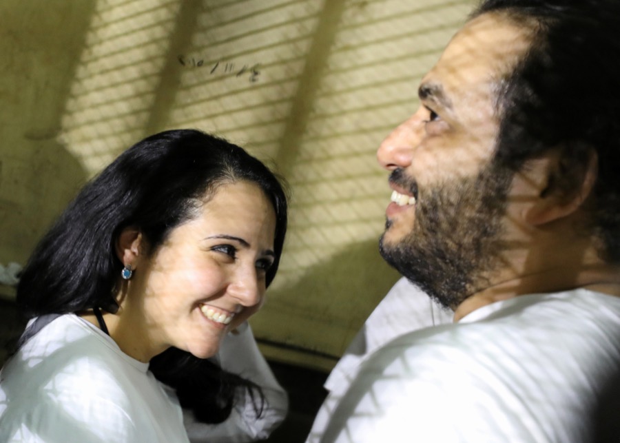 Aya Hijazi and her husband, Mohamed Hassanein, talk inside a holding cell. Aya Hijazi and her husband, Mohamed Hassanein, talk inside a holding cell.